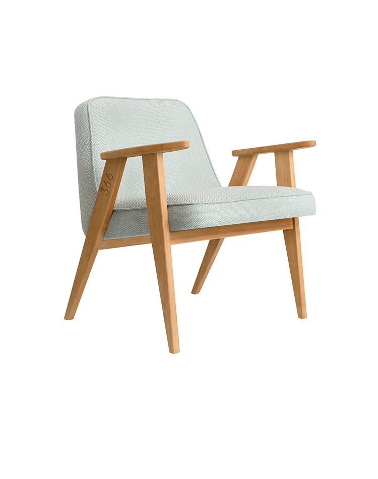 modern chair with wood handles and green cushion