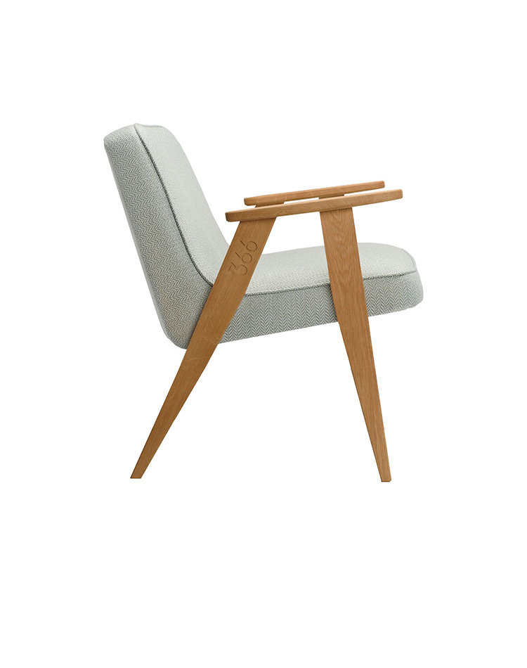 modern chair with wood handles and green cushion