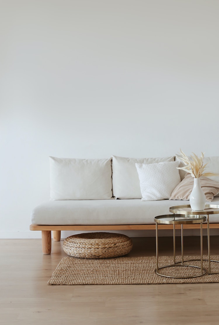 Living room with white sofa and vase on coffee table